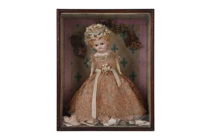 AN EARLY 20TH CENTURY BISQUE DOLL IN DISPLAY CASE
