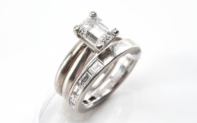 AN EMERALD CUT DIAMOND RING OF 1.54CTS WITH A FITTED WEDDER AND DIAMOND SET BAND ALL IN 18CT WHITE GOLD, ACCOMPANIED BY A COPY OF GI...