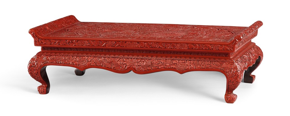 AN EXTREMELY RARE CARVED CINNABAR LACQUER ‘PHOENIX’ LOW TABLE MING DYNASTY, XUANDE PERIOD