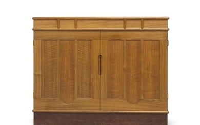 Alan Peters (1933-2009), a Devon Walnut and Rosewood Cabinet, 1989, the two panelled doors with inverted arch motif, 61cm high, 75cmwide , 56cm deep CITES Article 10 Certificate No: 6163144/02 Provenance: Commissioned by TSB Group plc.; Lloyds TSB...