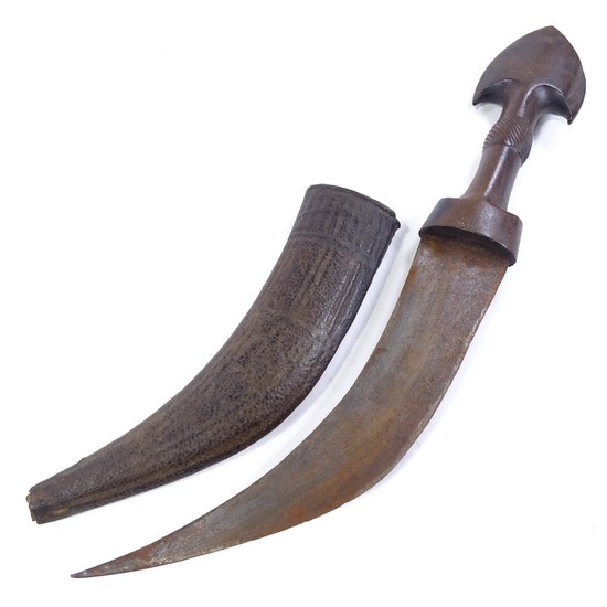An Antique Arab dagger with carved and shaped horn handle, o...