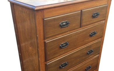 An Edwardian hardwood chest of drawers, the moulded rectangular top...