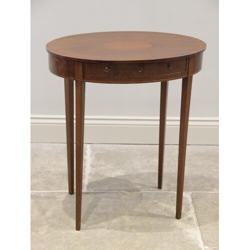 An Edwardian mahogany oval occasional table, the top with ov...