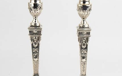 An English pair of sterling silver Victorian candlesticks - London...