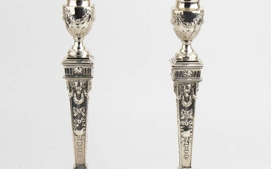 An English pair of sterling silver Victorian candlesticks -...