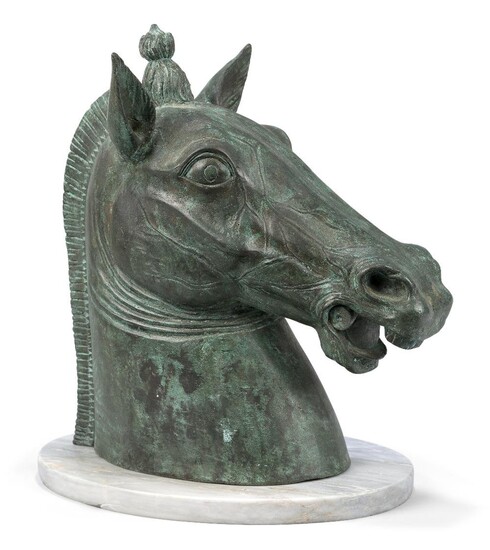 An Italian bronze horse's head, after the Horses of Saint Mark, Venice, early 20th century, on an associated oval marble base, 31cm high Provenance: The Geoffrey and Fay Elliot collection.