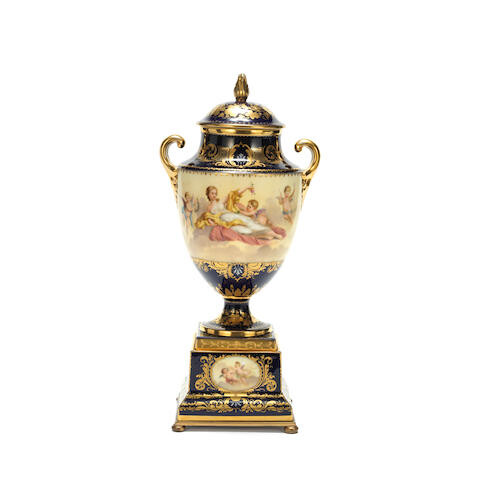 An early 20th century Continental Sèvres-style porcelain garniture vase and cover