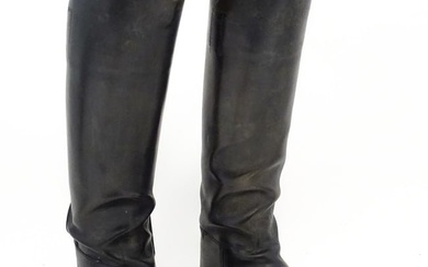 An early 20thC pair of black leather riding boots with trees, approx size 10 (2) Please Note - we