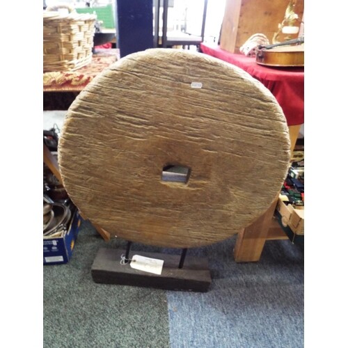 An early wooden wheel on stand