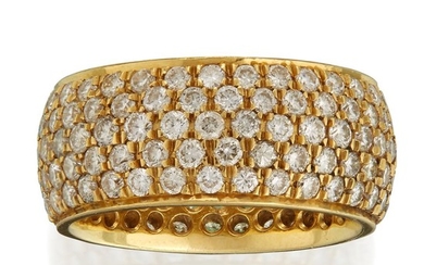 An eighteen karat gold and diamond band designed as...
