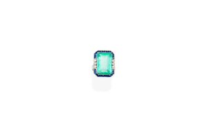 An emerald, sapphire and diamond ring