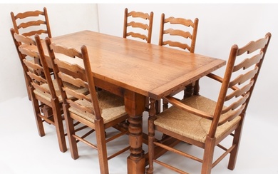 An oak extending refectory style dining table and six ladder...