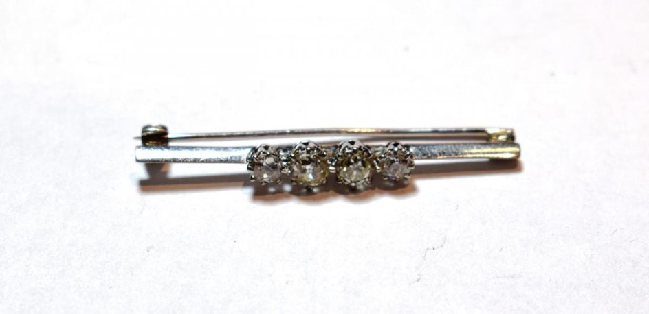 An old cut diamond four stone bar brooch, stamped '18CT',...