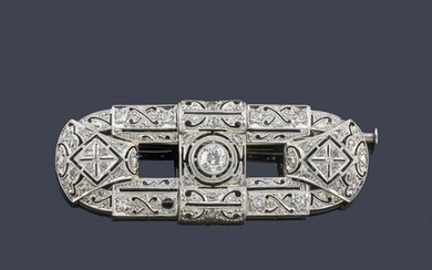 Antique-cut diamond plate brooch in platinum.