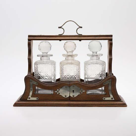 BOTTLE BOX, SO-CALLED TANTALUS, WITH THREE BOTTLES, BEGINNING OF THE 20TH CENTURY.