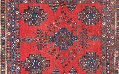 Blue and red ground rug with all over geometric design