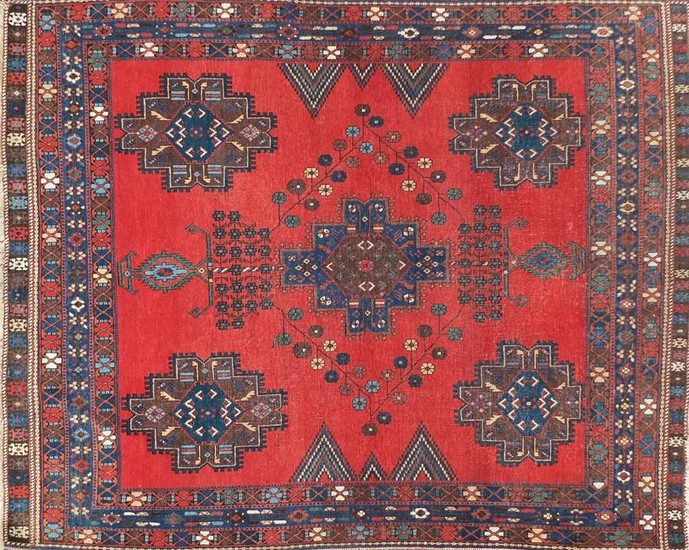 Blue and red ground rug with all over geometric design