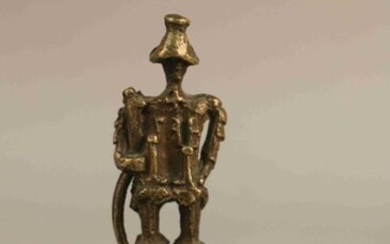 Bronze STATUTE known as "Seine lead" representing a pilgrim with a cope. 16th century style. Bronze nail decorated with a grimacing head. Small STATUETTE of an elongated feline. (Accidents)