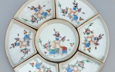 CHINESE FAMILLE ROSE PORCELAIN SEVEN-PIECE SWEETMEAT SET Each condiment tray with gilt rims and decoration of scholars' items. Assem..
