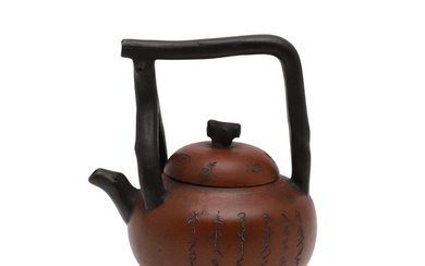 CHINESE YIXING TEAPOT - SEAL MARK. The pottery teapot with a...