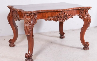 Carved mahogany Victorian turtle shaped center table