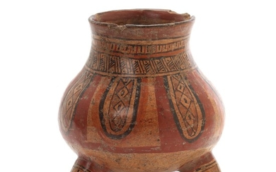 Costa Rica tripod jar of red-fired clay decorated in colours with design, feet shaped like animal heads. 1000–1400. H. 15.5 cm.