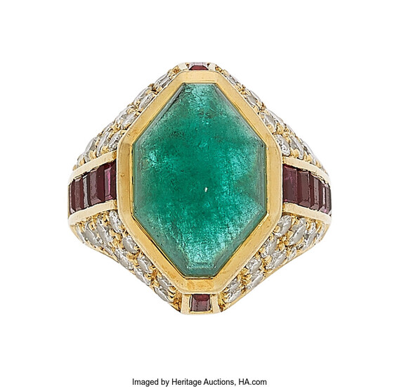 Emerald, Diamond, Ruby, Gold Ring The ring features an...