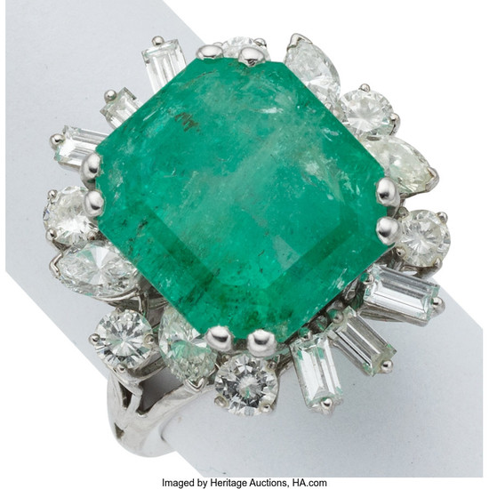 Emerald, Diamond, White Gold Ring The ring features an...