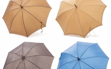 Ensemble de 4 parapluies comprenant : 1 Gucci, 2 Christian Dior et 1 Kobold