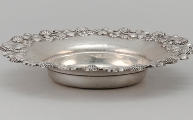 FERDINAND FUCHS & BROTHERS STERLING SILVER DISH With a cast clover flower and leaf border. Not monogrammed. Diameter 7.25". Approx....