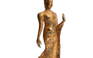 Figure de bouddha marchant du XIXe siècle en bronze dore, main gauche levee en abhaya...
