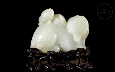 Figure of a carved jade "Lion with young on its...