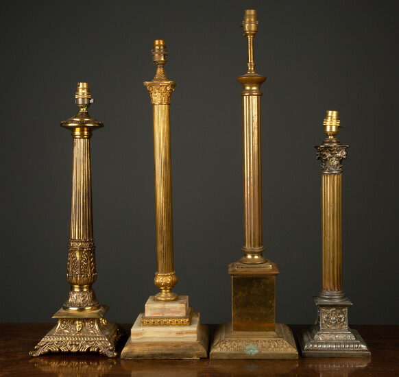 Four gilt metal table lamps