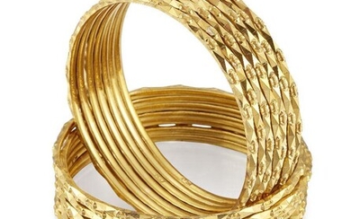 Fourteen bangles, of matching geometric hoop design, internal diam. 5.6cm...