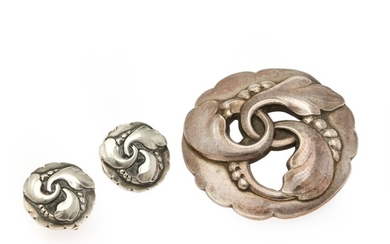 Georg Jensen: A sterling silver jewellery collection comprising a brooch and a pair of ear clips. Design no. 20 and 93. Georg Jensen after 1945. (3)