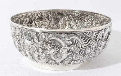 Good quality late 19th century Chinese Export silver bowl with embossed decoration depicting Dragons amongst clouds, marks to base for Wang Hing