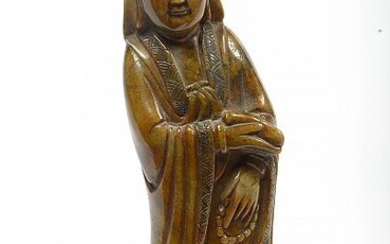 "Guanyin" en pierre de lave sculptée et gravée. Travail chinois. Epoque: XVIIIème (?). (Légers *). H.:+/-20cm.