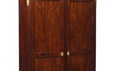 Moulded mahogany cupboard opening with two doors, the rounded uprights resting on small tapered legs. Louis XVI style, late 19th century. H : 199 cm, W : 154 cm, D : 42 cm