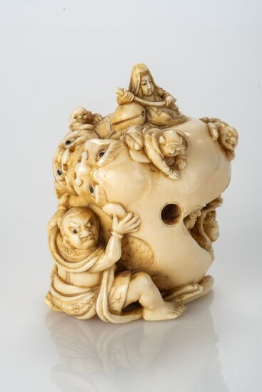 Okimono, Sculpture - Elephant ivory - A Nio 仁王 (Benevolent King) holds a double-shishi mokugyo from which the 7 Lucky Gods emerge - Japan - Meiji period (1868-1912)