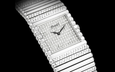 PIAGET. AN 18K WHITE GOLD AND DIAMOND-SET BRACELET WATCH MANUFACTURED IN 1985
