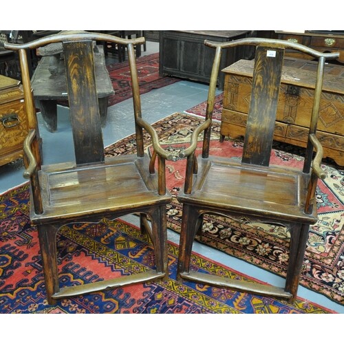 Pair of Chinese stained wooden splat backed elbow chairs wit...