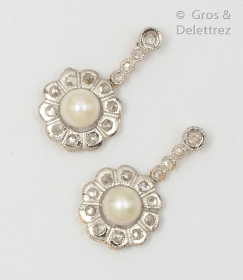 Pair of yellow gold and white gold earrings, set with cultured pearls in an entourage and surmounted by rose-cut diamonds. Length: 2.2cm. Rough weight: 4.1g.