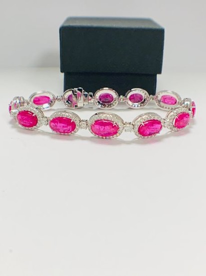 Platinum Ruby and Diamond bracelet featuring, 12 oval...