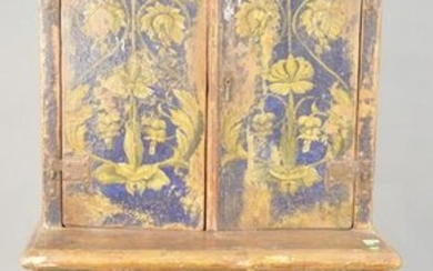 Primitive paint decorated cupboard, having two over two