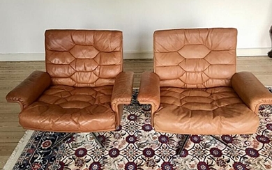 NOT SOLD. Robert Hausmann: A pair of swivel easy chairs, upholstered with patinated leather. H. 68 B. 60 cm. (2) – Bruun Rasmussen Auctioneers of Fine Art