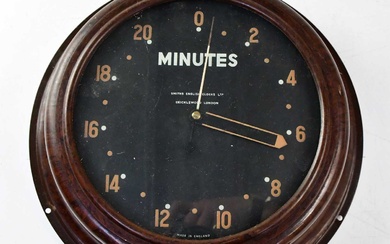 SMITHS; a vintage Bakelite wall-mounted alarm clock, the black dial...