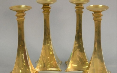 Set of four modern brass candlesticks, tapered neck