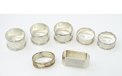 Seven assorted silver napkin rings, various dates and makers...