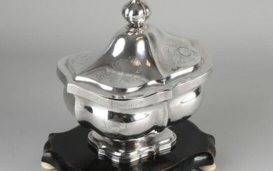 Silver tobacco jar, 833/000, on wooden base.&#160