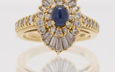 18KT GOLD, DIAMOND AND SAPPHIRE RING Central sapphire...